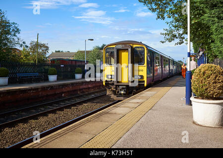 British Rail Class 150 'Sprinter' diesel multiple-units (DMUs; DMU) arriving at Poppleton Station, York, United Kingdom on a sunny day. Stock Photo