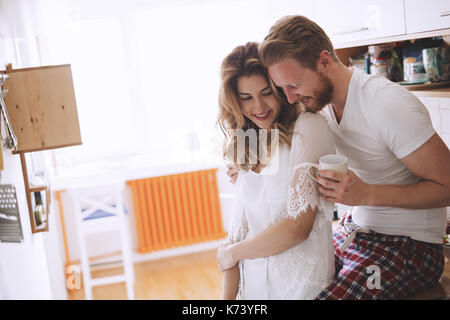 Beautiful couple having fun being romantic in the morning Stock Photo