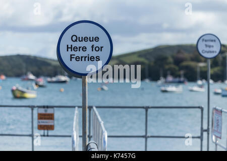 Queue here for ferries sign at Salcombe, Devon, on the Kingsbridge estuary, a ria in Devon, UK. Stock Photo