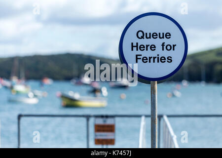 Queue here for ferries sign at Salcombe, Devon, on the Kingsbridge estuary, a ria in Devon, UK. Stock Photo