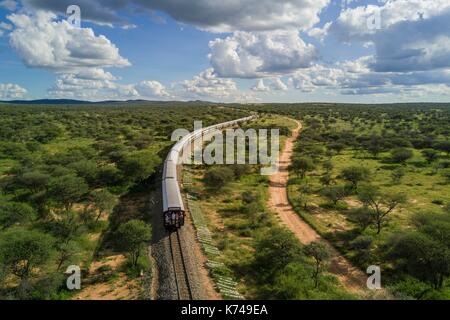 Namibia, Otjozondjupa region, the Shongololo express train crossing the Namibian bush towards Kalkfeld (aerial view) Stock Photo