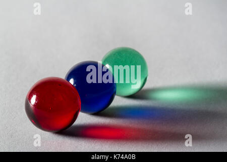 Handful of Red Marbles Stock Photo - Alamy