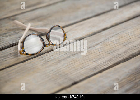 Close up of eyeglasses on wooden table Stock Photo