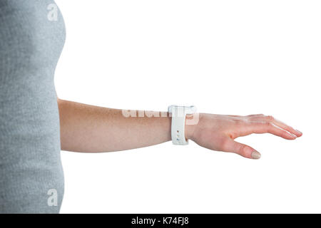 Cropped image of businesswoman wearing smart watch against white background Stock Photo