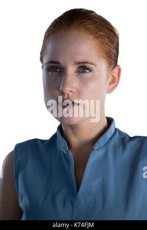 Close up of thoughtful businesswoman with gray eyes against white background Stock Photo