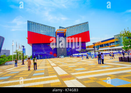 OSAKA, JAPAN - JULY 18, 2017: Unidentified people walking to Aquarium Kaiyukan in Osaka. It is an aquarium located in the ward of Minato in Osaka, Japan, near Osaka Bay Stock Photo