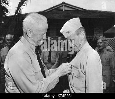 Feb 20, 1945 - Fleet Admiral C.W. Nimitz decorating Vice Admiral Marc A. Mitscher, USN, with the Legion of Merit and Navy Cross. Stock Photo