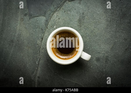 White ceramic cup of espresso coffee on a grey slate surface 14.09.2017 PHILLIP ROBERTS Stock Photo