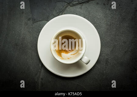 White ceramic cup of espresso coffee on a grey slate surface 14.09.2017 PHILLIP ROBERTS Stock Photo