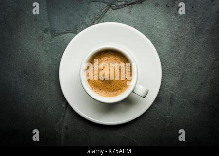 White ceramic cup of espresso coffee on a grey slate surface 14.09.2017 PHILLIP ROBERTS Stock Photo