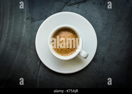 White ceramic cup of espresso coffee on a grey slate surface 14.09.2017 PHILLIP ROBERTS Stock Photo