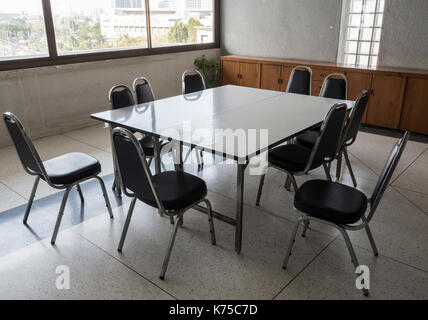 Table and metal chair set for informal conference in the morning before the office hour outside the office area. Stock Photo