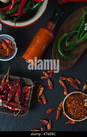 Overhead of various spices arranged on black background Stock Photo
