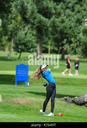 Junior child teenager playing golf in England UK Stock Photo