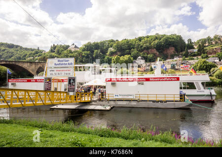 TRIER, GERMANY - 4TH Aug 17: Tourists queing at the ticket office for river cruises along the River Rhine at Mosel Saar Rundfahrten Kolb. Stock Photo