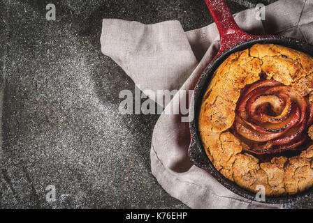 Traditional autumn baking, recipes for thanksgiving, Homemade wholegrain apple galette pie with organic apples and cinnamon, In iron cast pan, black s Stock Photo