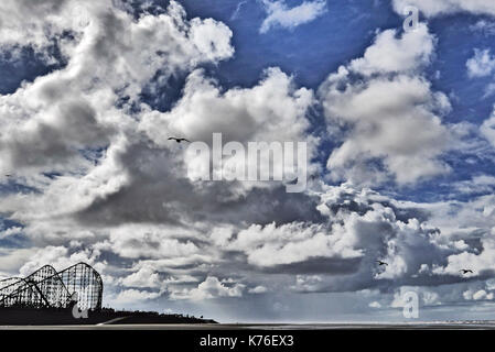 The Big One roller coaster silhouetted against a dramatic cloudy sky,Blackpool,Lancashire,UK Stock Photo