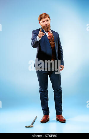 The barded man in a suit holding cane. Stock Photo