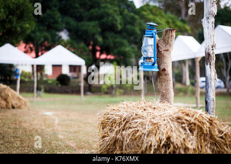 Some resort decorate their place in contry theme. They use old lantern, straw, well and backdrop that relate to cowboy style. Stock Photo