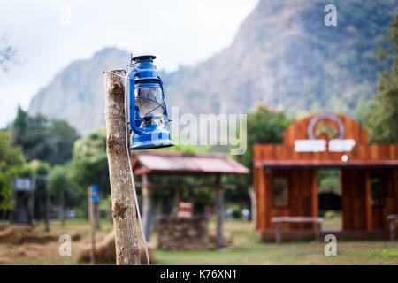 Some resort decorate their place in contry theme. They use old lantern, straw, well and backdrop that relate to cowboy style. Stock Photo