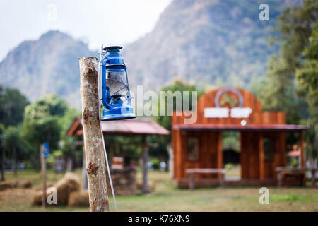 Some resort decorate their place in contry theme. They use old lantern, straw, well and backdrop that relate to cowboy style. Stock Photo