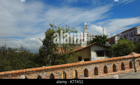 View of the Todos Santos Church from the broken bridge in the city of Cuenca Stock Photo