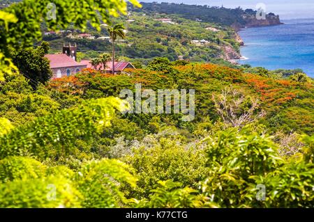 United Kingdom, Montserrat, English-speaking Caribbean, Gingerbread Hill, overlooking the church surrounded by greenery up to the coast Stock Photo