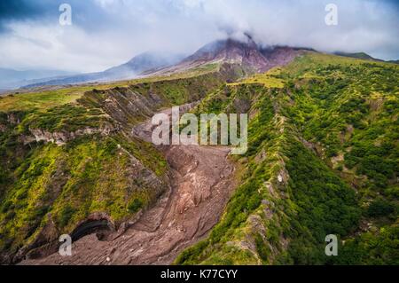 United Kingdom, Montserrat, English-speaking Caribbean, the flanks of the volcano bearing the stigmata of pyroclastic flows, the Soufriere Hills volcano (915 m) in the background (aerial view) Stock Photo