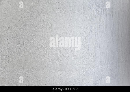 Rough light white colored surface for backgrounds and textures. Stock Photo