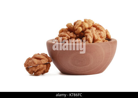 Walnuts shelled in a bowl isolated on white background. Side view. Walnut kernels in a bowl. Stock Photo