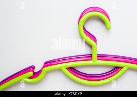 Colourful clothes hanger on white canvas background Stock Photo