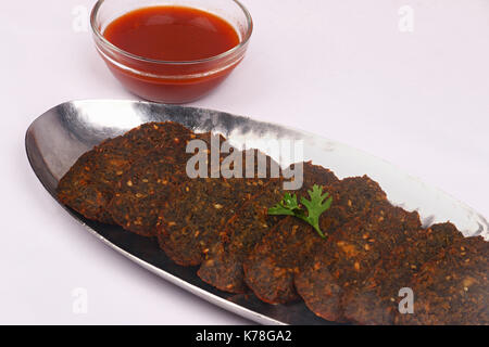 Indian snack, Kothimbir Vadi, Coriander and chickpea fritters Stock Photo