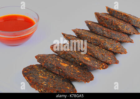 Indian snack, Kothimbir Vadi, Coriander and chickpea fritters Stock Photo