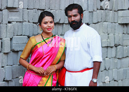 Portrait of Maharashtrian couple dressed in Nauwari sari and Kurta Stock Photo