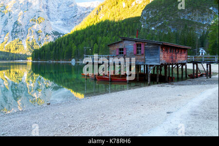 Braies lake and house in the background of Seekofel mountain in Dolomites,Italy ( Pragser Wildsee ) Stock Photo