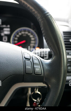 close up steering wheel with multi function botton ,car interior Stock Photo