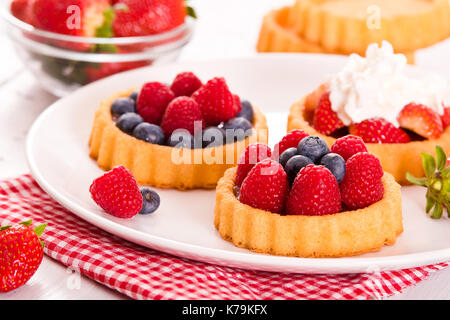 Tartlets with forest fruits. Stock Photo