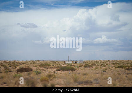 Kayenta, AZ - 25 July 2016: Rural housing estate of Native Americans at the Navajo reservation (Navajo Nation) in the Arizona desert. With a populatio Stock Photo