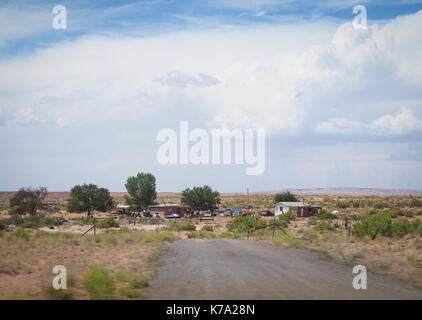 Kayenta, AZ - 25 July 2016: Rural housing estate of Native Americans at the Navajo reservation (Navajo Nation) in the Arizona desert. With a populatio Stock Photo