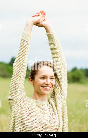 Woman stretching, portrait Stock Photo