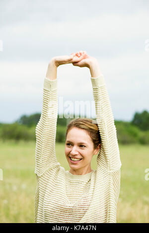 Woman stretching, portrait Stock Photo