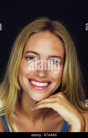 Young woman smiling cheerfully, portrait Stock Photo