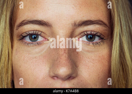 Close-up of young woman's face and eyes Stock Photo