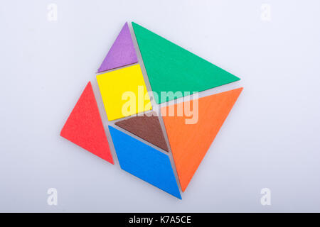 Colorful pieces of a square tangram puzzle Stock Photo