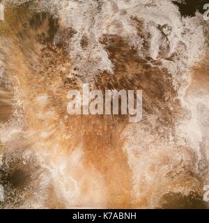 Abstract liquid gold background. Pattern with abstract golden and black waves. Marble. Handmade surface. Liquid paint. Acrillic wallpaper. Mineral texture. Stock Photo