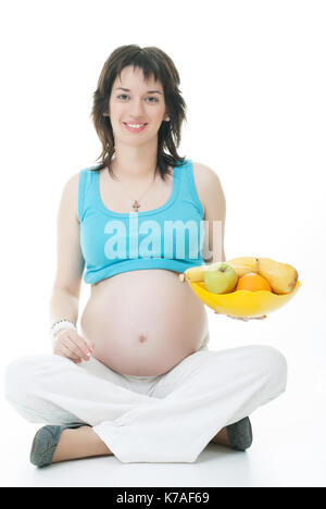 pregnant young woman with a basket of fruit Stock Photo