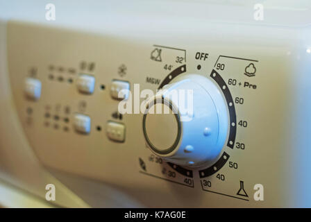Control panel of washing machine. Natural light, high-contrast dark and sacred tones Stock Photo