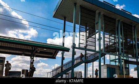 Pasadena, California, USA. 14th Sep, 2017. Commuters wait at a Metro Rail Station in Pasadena California as milder weather returns to Southern Calfornia with blue skys and puffy clouds along with lower temperatures give a hint of autumn weather. Credit: John Crowe/Alamy Live News Credit: John Crowe/Alamy Live News Stock Photo