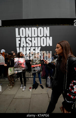 Protesters gathered outside The Store Studios during London Fashion Week to demonstrate their feelings on the use of fur. Animal rights protest Stock Photo