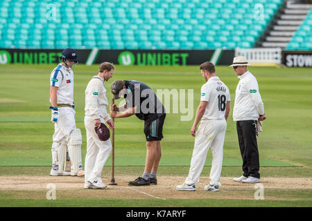 London, UK. 15th Sep, 2017. Groundstaff repair the bowlers front foot area on day four of the Specsavers County Championship match at the Oval. Credit: David Rowe/Alamy Live News Stock Photo